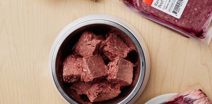 Frozen raw meat in a bowl